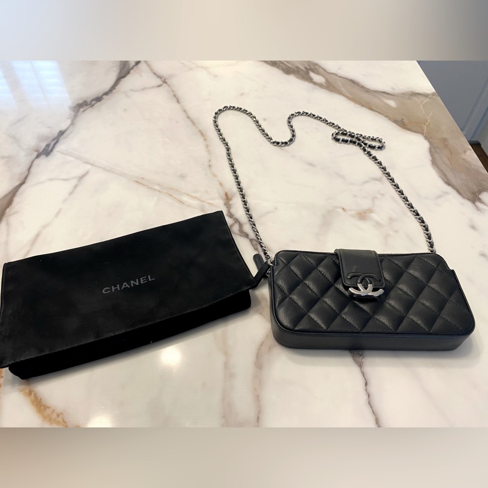 Chanel black clutch with removable chain. Dust bag included